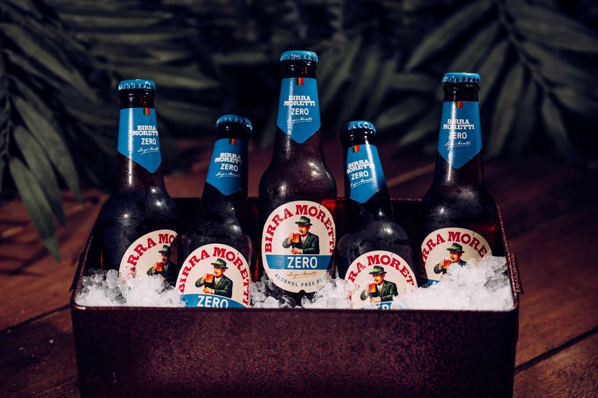 0% Moretti bottles displayed in a tray of ice.