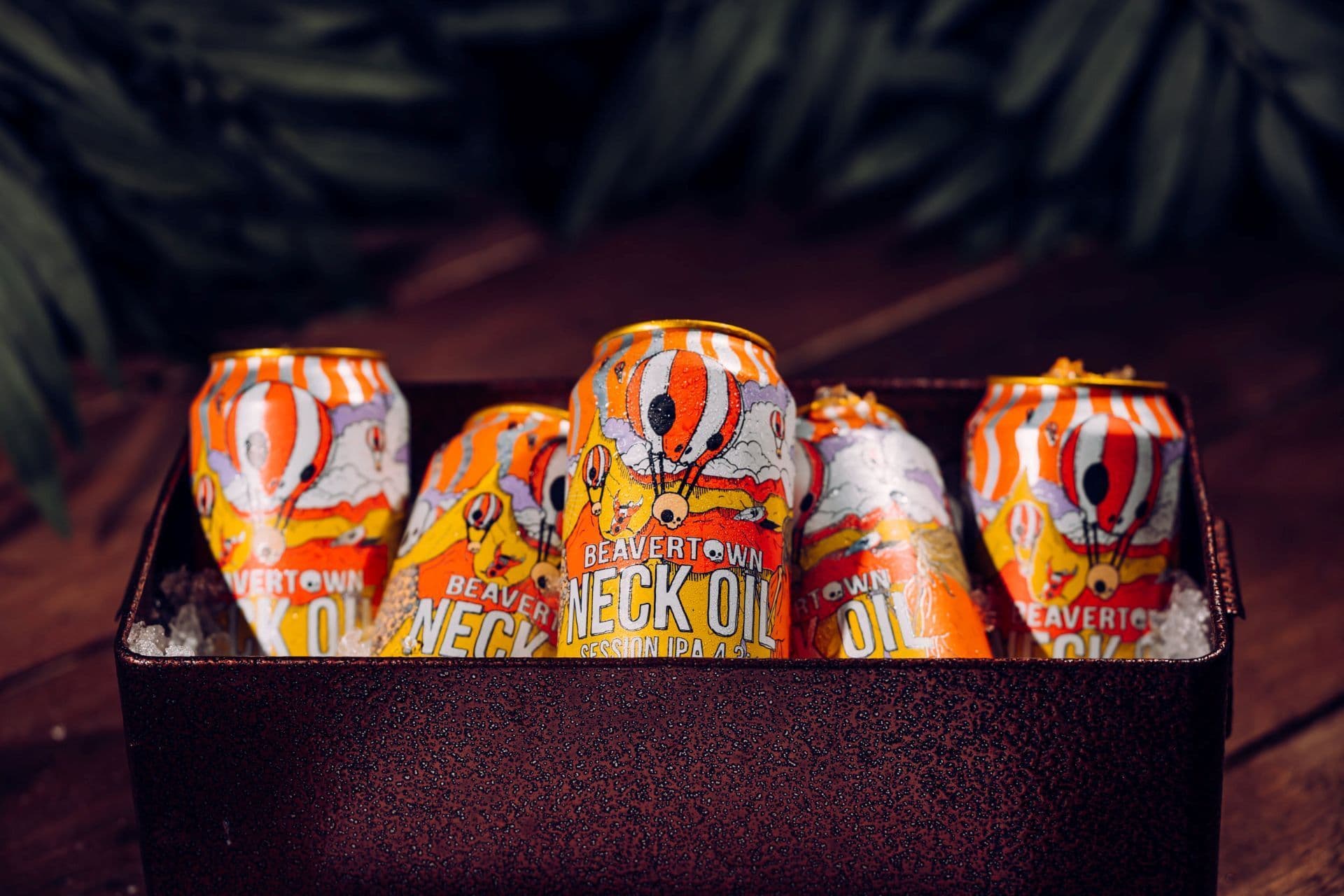 Neck oil beers displayed in a tray of ice.