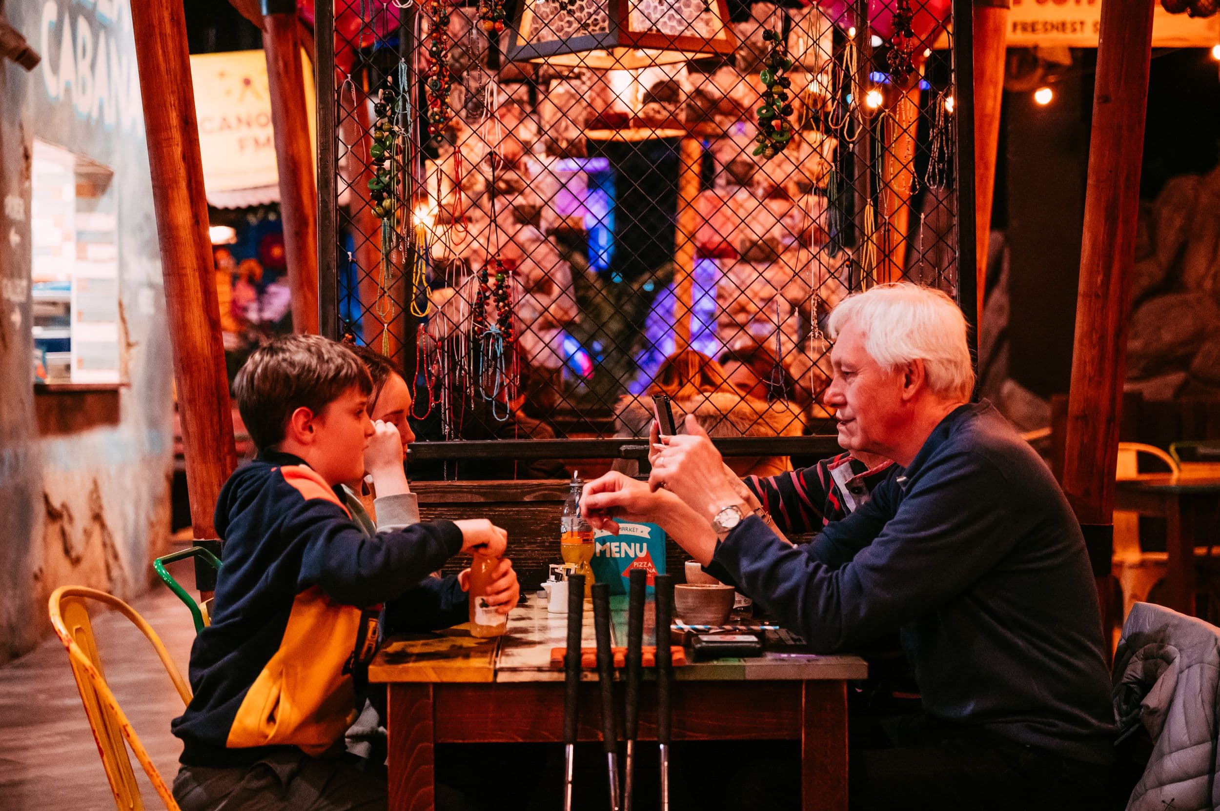 A family enjoying drinks in the market.