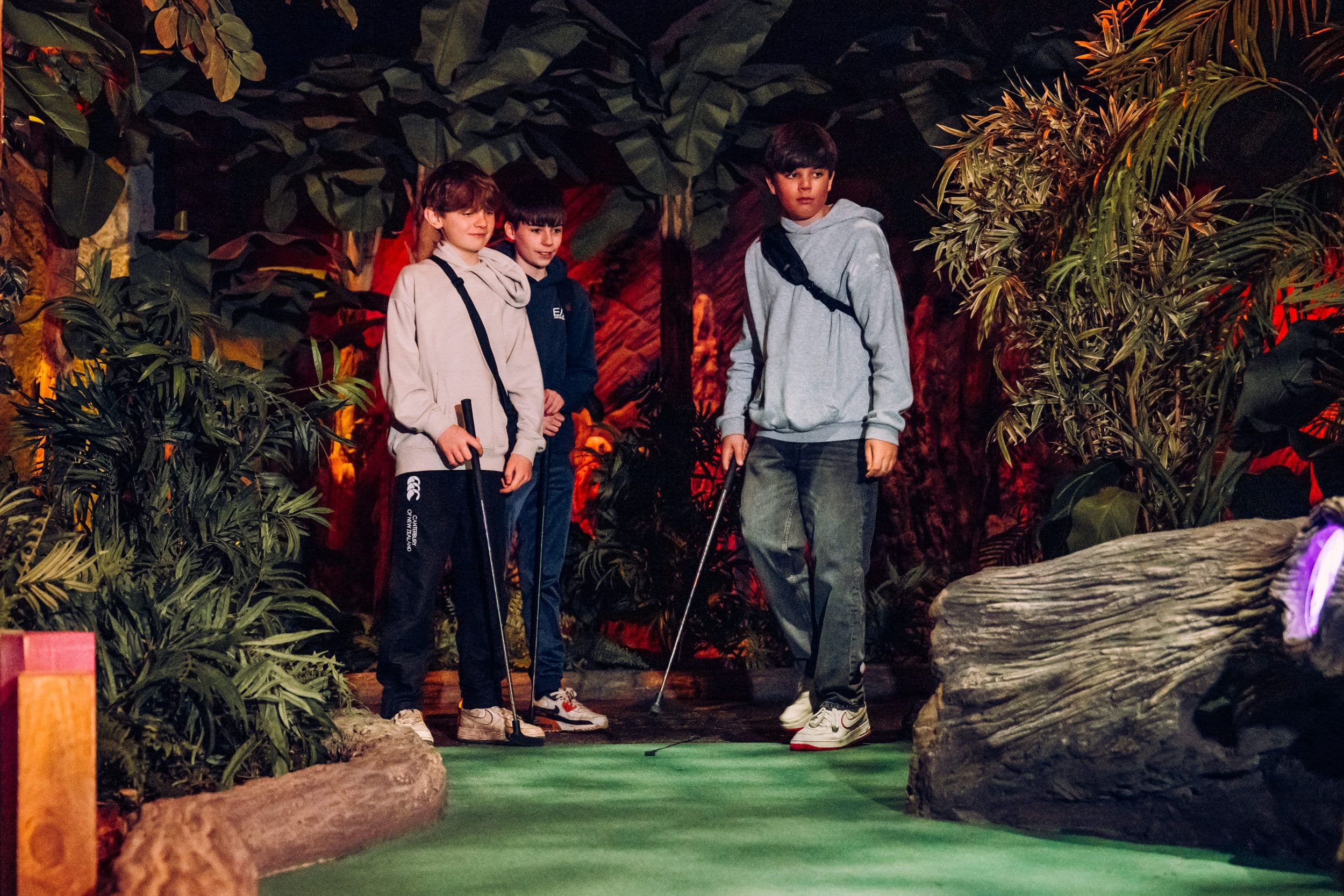 Three Children Playing Golf