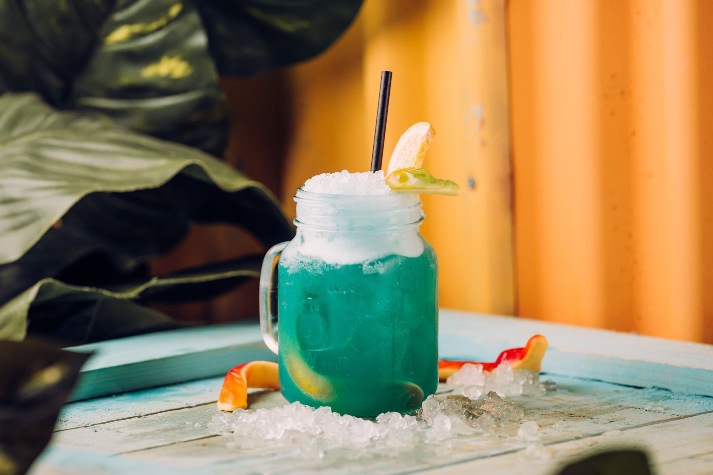 A fluorescent blue mocktail displayed in ice at Treetop Golf.