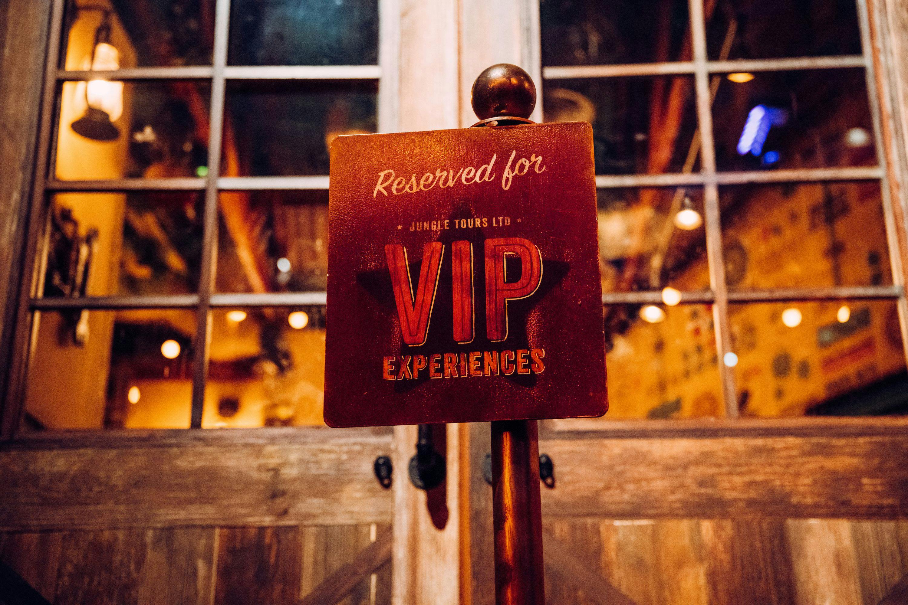 Image of the VIP experiences ‘reserved for’ sign written on a block of wood with a star. 