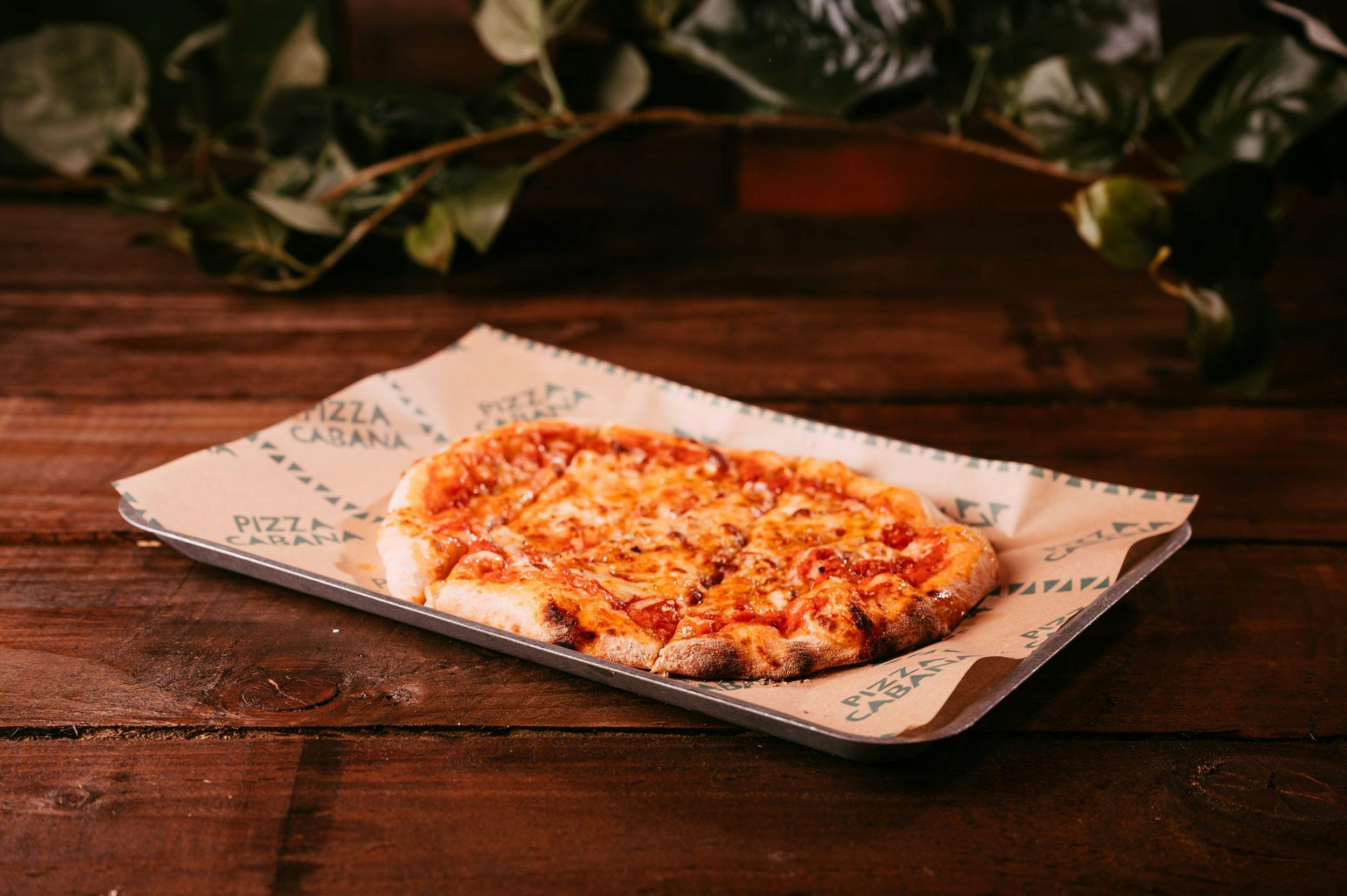 Cheesy, wonky based margherita pizza on a classic Treetop tray. 