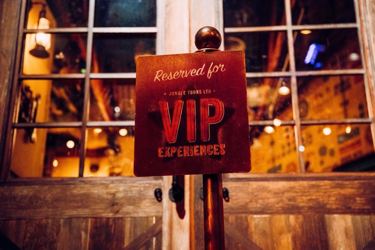 Close up of the VIP Experience reservation sign.